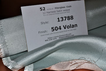 Heavy satin weave fiberglass cloth style 13788 loose on table with info sheet