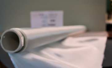 220 blurry photo of roll on 2" pvc fiberglass cloth from Thayercraft